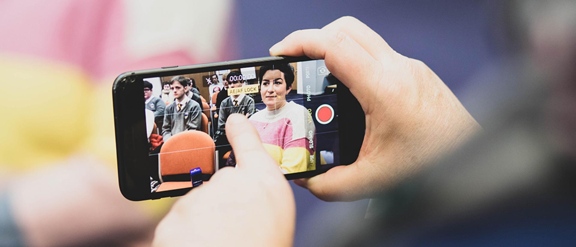 Young people making their own films on a smartphone