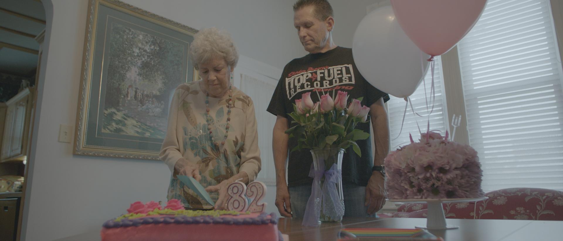 A woman celebrates her 82nd birthday with her son