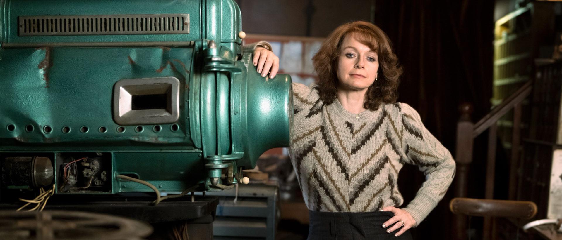 samantha morton in save the cinema standing next to an old cinema projector