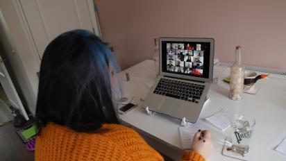 a photo of a person participating in an online meeting