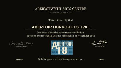 a black screen with white text that reads: Aberystwyth Arts Centre. This is to certify that ABERTOIR HORROR FESTIVAL has been classified for cinema exhibition between the fourteenth and nineteenth of November 2023.