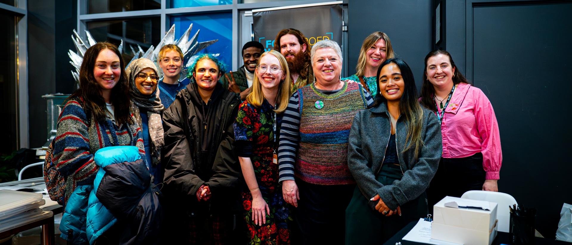 11 people posing for a photo