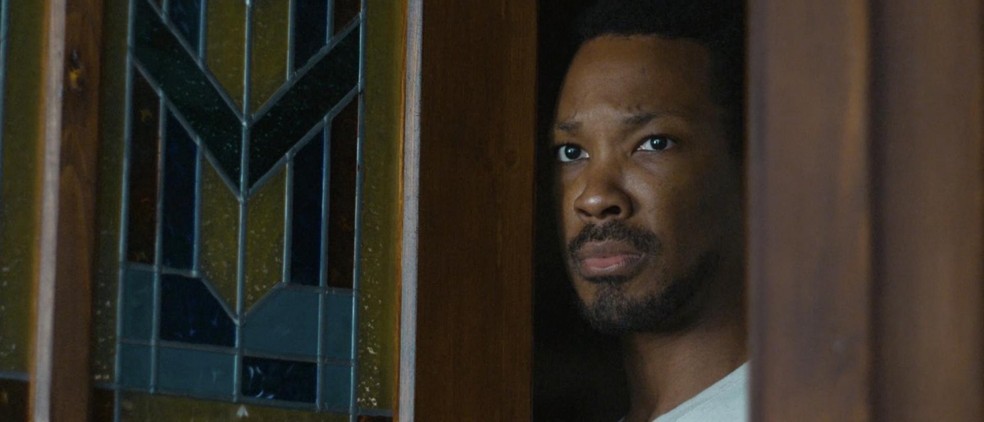 still from the man in my basement featuring a man answering his front door