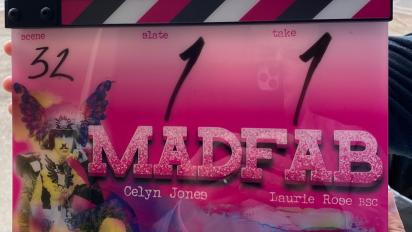 a pink clapperboard featuring the title "madfab"